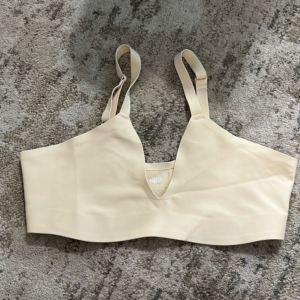 Cream colored, nylon bra (no padding/underwire)